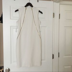 Calvin Klein white dress with zippers.